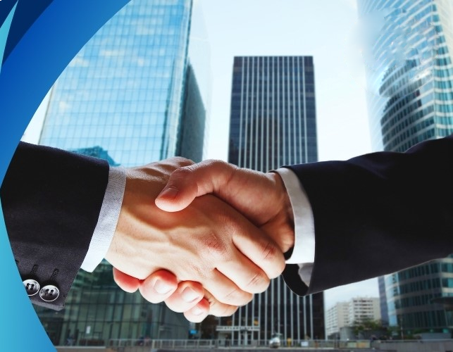 Business handshake with city skyline